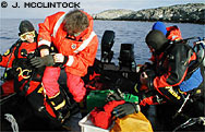 Dry suits come equipped with gloves that seal water tight at the wrists. Hard rings at the wrist seals help keep the gloves in place. By Jim McClintock.



