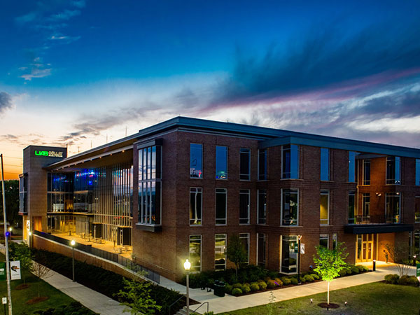 Collat School of Business building at sunset. 