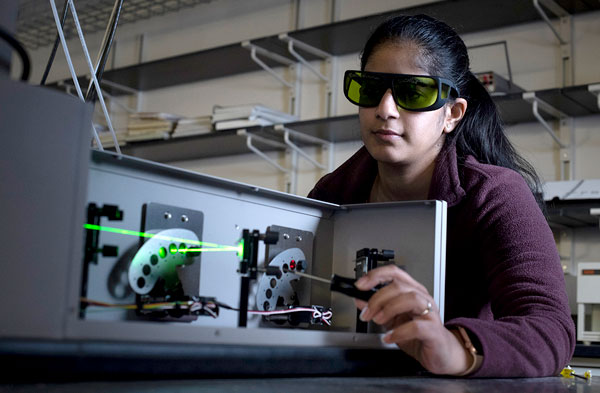 Student using lasers in the lab.