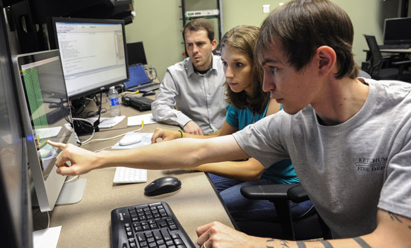 Several students in a UAB CIS computer lab. 