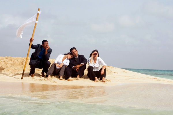 Four graduate students on sitting on a deserted island.