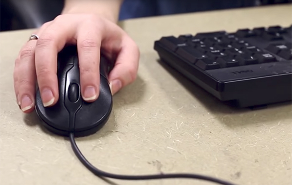 Student using a computer mouse