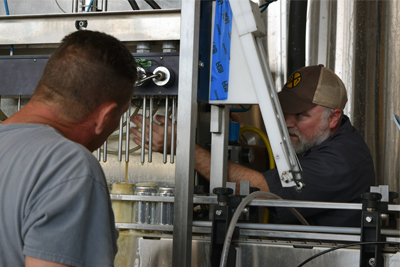 DeBoer working in his brewery with staff.