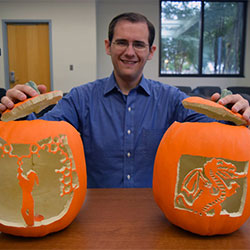 Michael Schultz with pumpkin carvings.