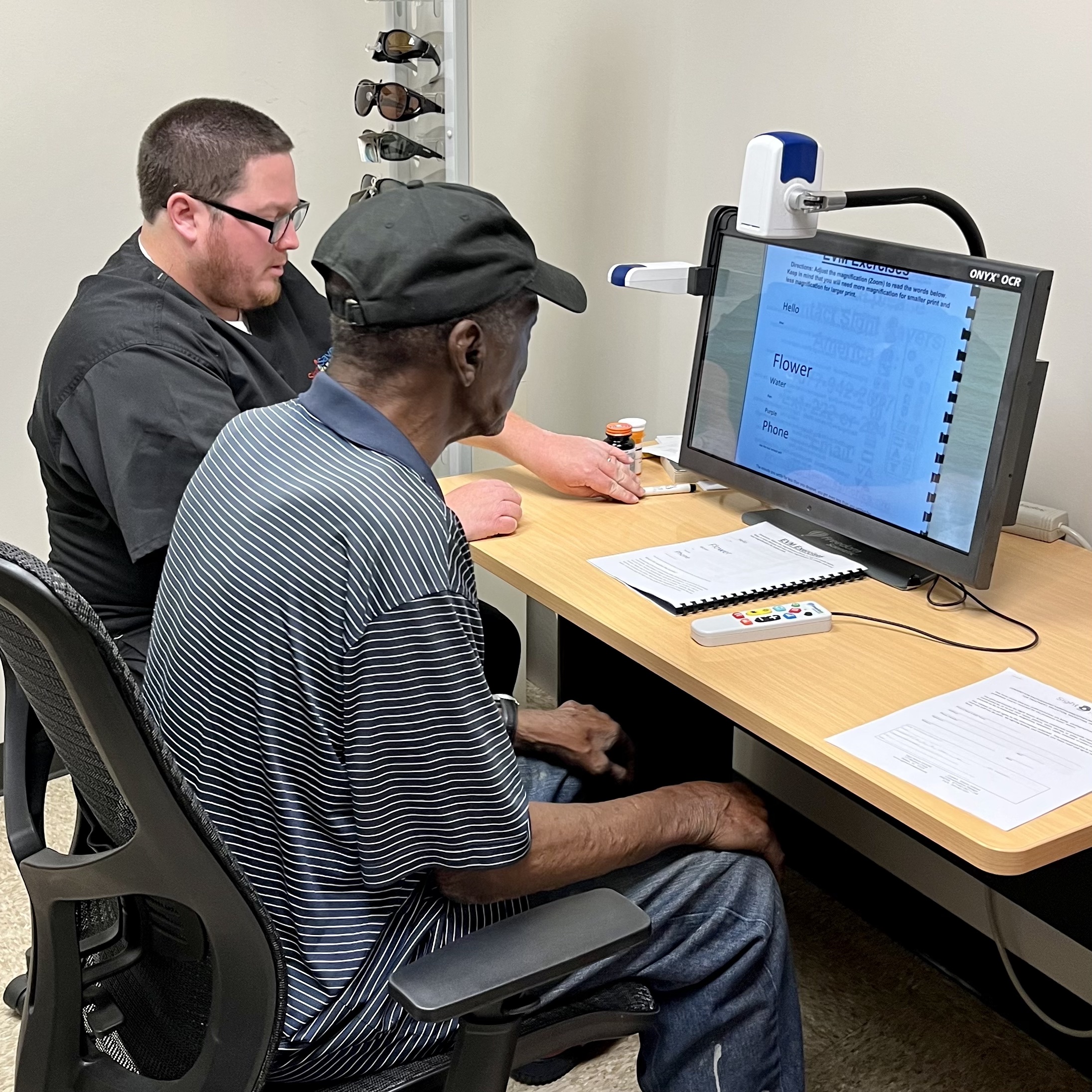 Samuel Kennedy receives training on his new vision aid at the UAB Center for Low Vision Rehabilitation.