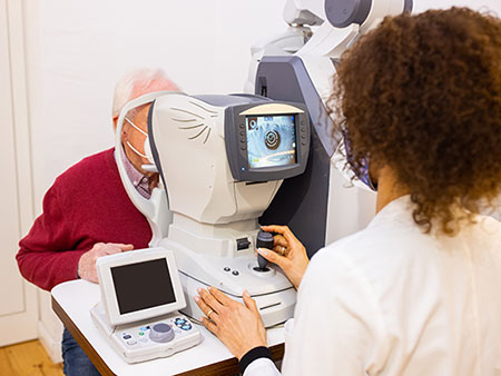 Healthcare worker conducting a vision screening