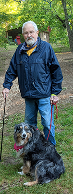 Patrick Jones standing with dog.