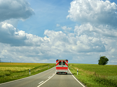 Ambulance driving on a rural Highway