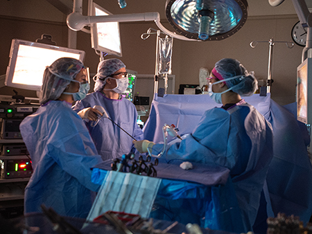 Dr. Jayme Locke, MD (Associate Professor, Surgery - Transplantation) and scrub nurses are performing a kidney transplantation surgery as part of UAB's Kidney Chain surpassing 100 surgeries, 2018.
