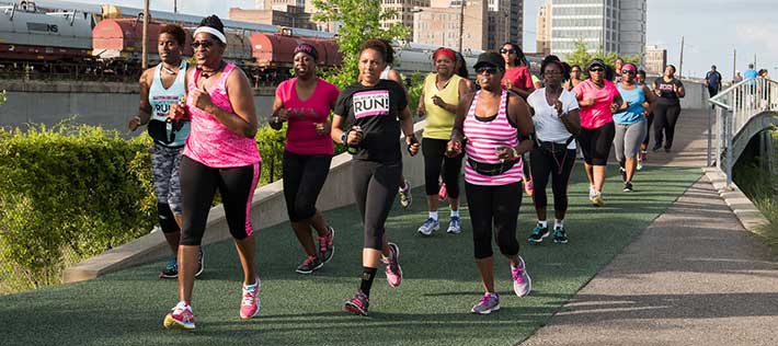 Olivia Affuso (center) and members of Black Girls Run Birmingham on an evening run at Railroad Park