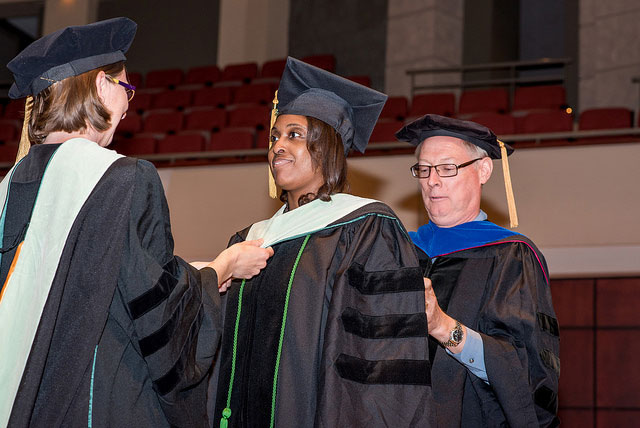 Carey Dillard being hooded at her Convocation and Hooding Ceremony
