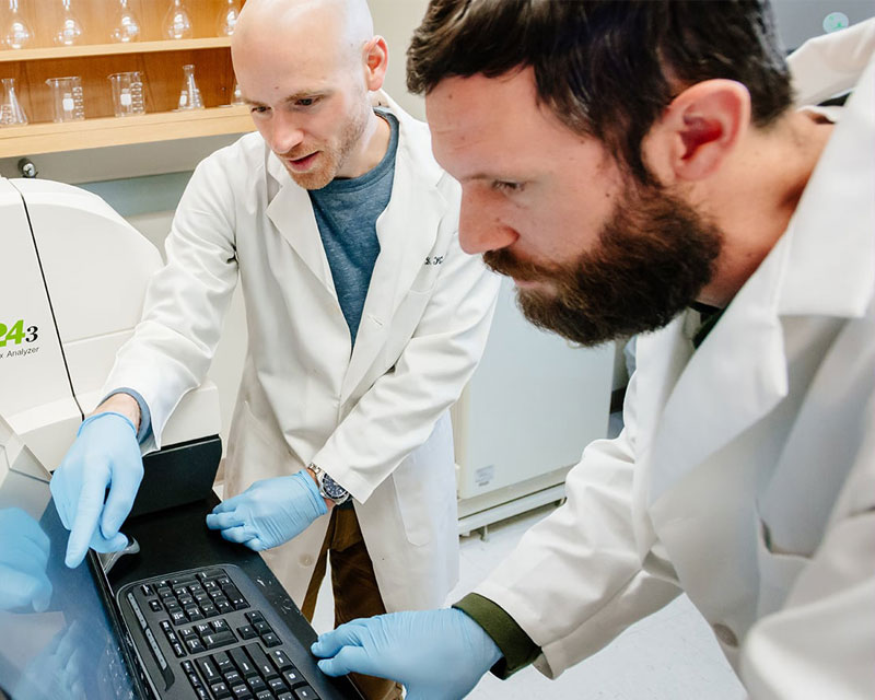 Two researchers working in a lab.