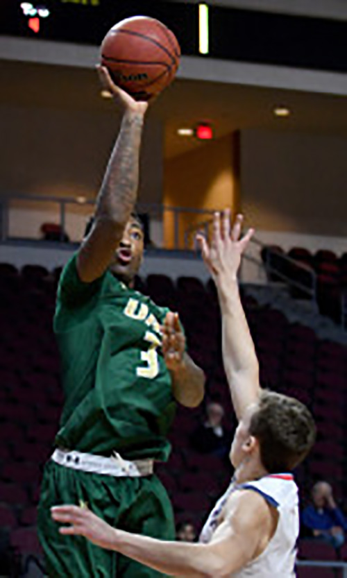 Dirk Williams goes in for a layup in the win against George Washington University. Photo from UABsports.com