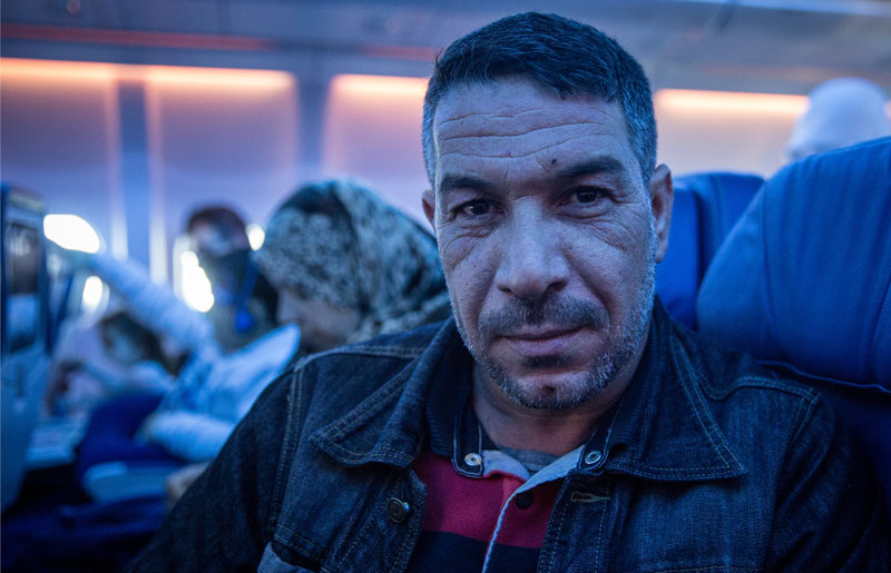 Photo of Syrian refugee on airplane