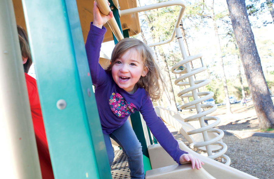 Photo of little girl on playground