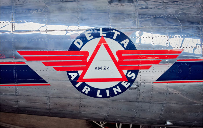 Close of vintage Delta Air Lines logo on silver airplane