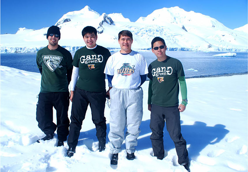 Photo of students wearing UAB shirts in Antarctica