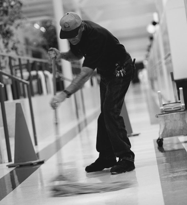 Photo of man mopping floor