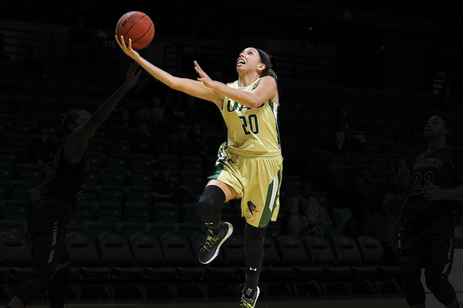 Photo of player Rachael Childress jumping toward the goal during a Bartow Arena game
