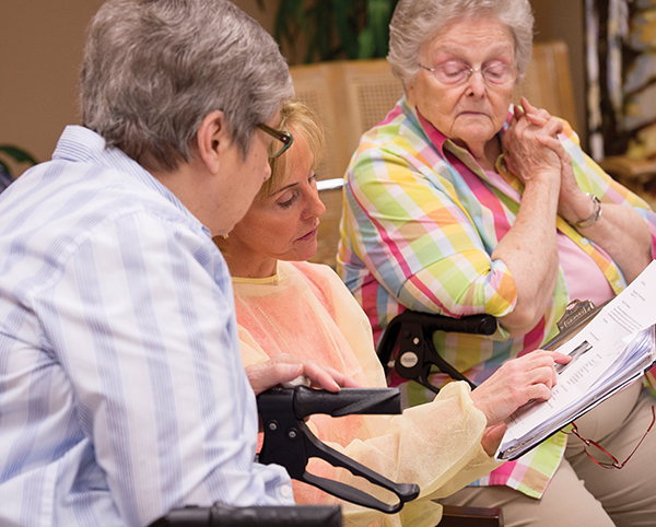 Lillian Mitchell consults with geriatric dental patients on their care.