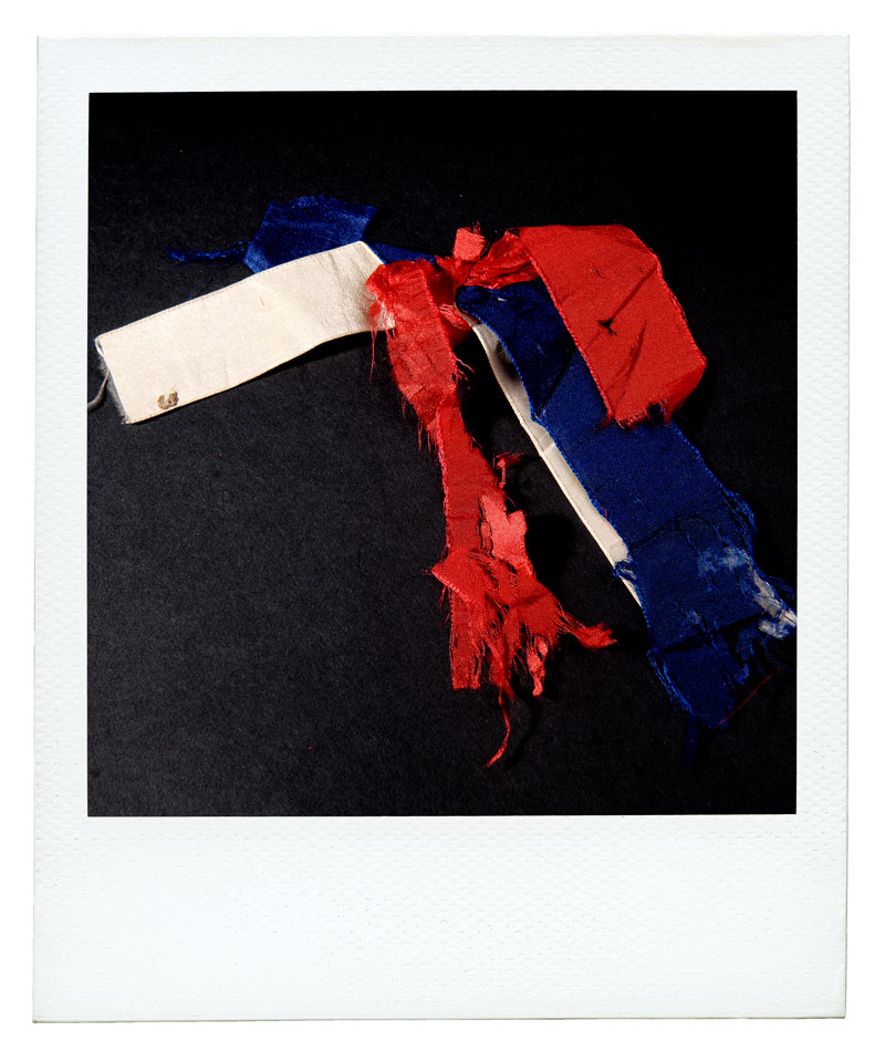 Photo of ragged red, white, and blue ribbon