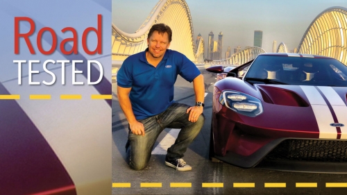 Photo of Trevor Hale on Dubai test track with Ford car; title: Road Tested