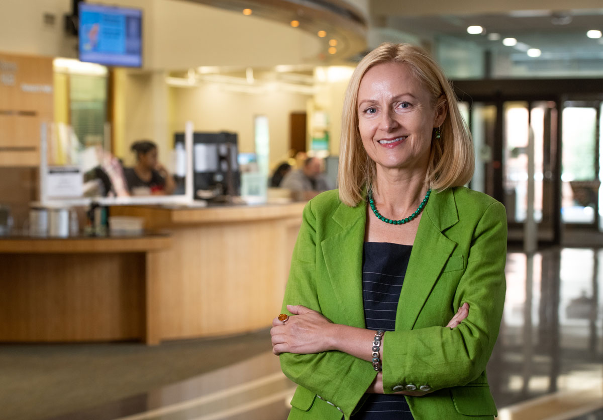 Dean of UAB Libraries Kasia Gonnerman stands in the lobby of one of UAB's libraries. 