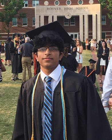 Madhav at his Hoover High School graduation, in black robes and blue striped tie. 