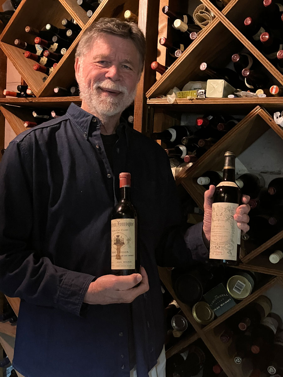 Collat Professor Emeritas Joe Van Matre in his wine cellar.
