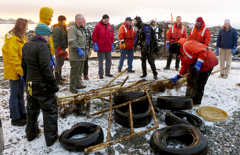 The pile of tires, ship railing, and smaller materials collected on the Earth Day dive.