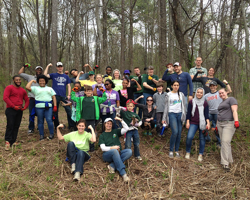 Image of UAB employees and students posing after working at Red Mountain Park.