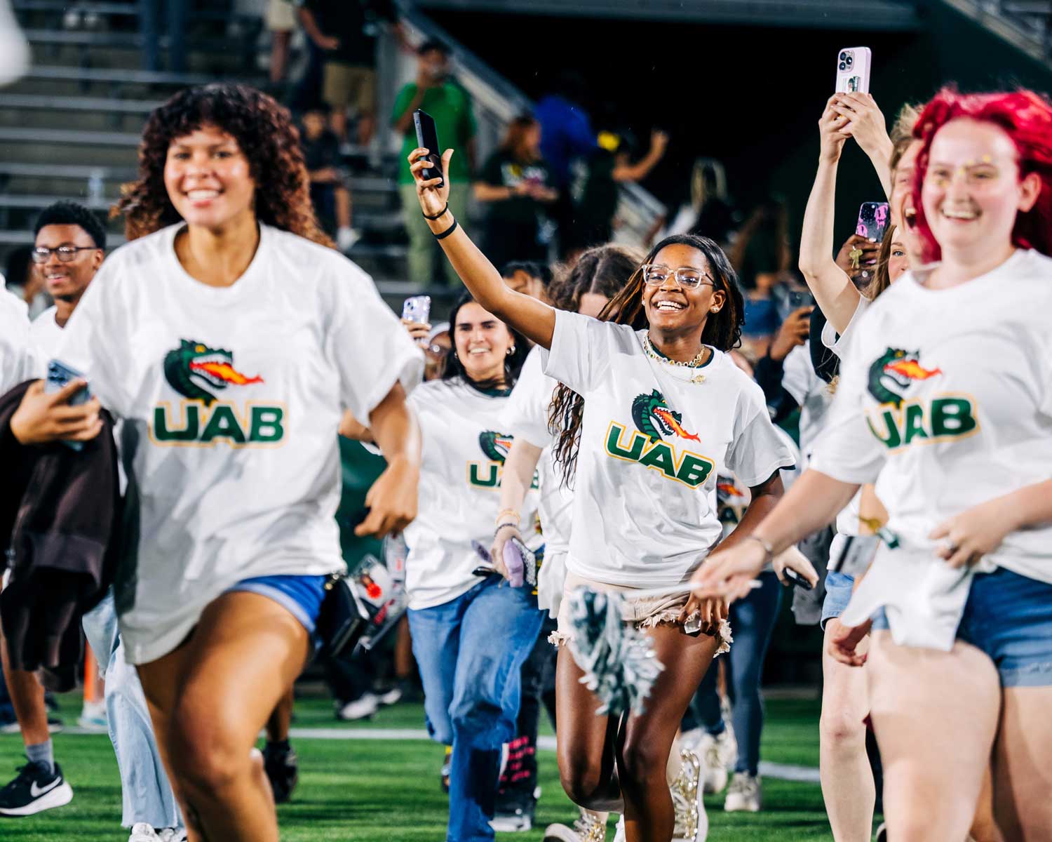 Image of a group of people wearing t-shirts with UAB spirit marks