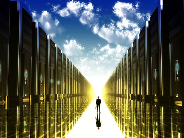 Stylized image of person walking through towering mainframes, a blue sky with clouds above. 