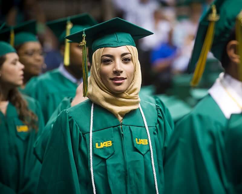 A UAB graduate wearing a hijab under her cap. 