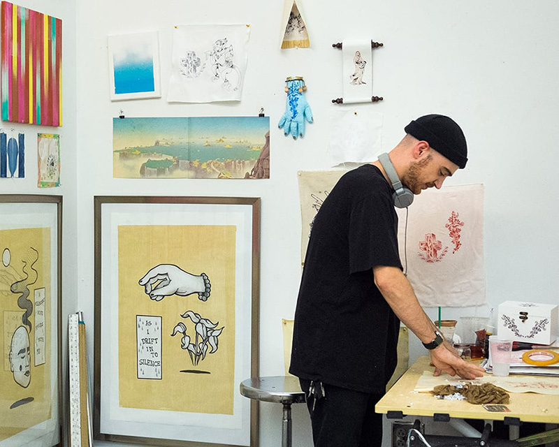Artist working in his studio