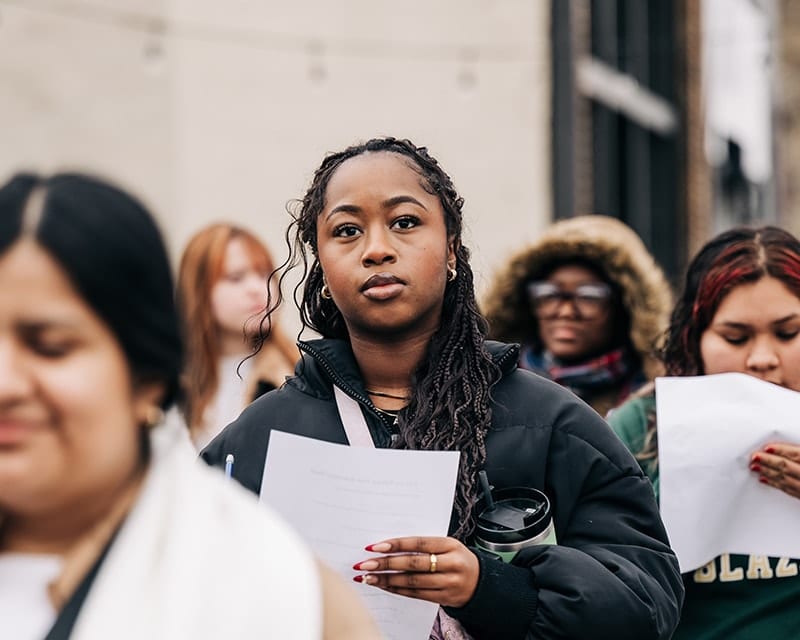 A woman with a paper in hand.