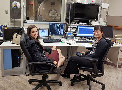 Students at the control console of an MRI machine. 