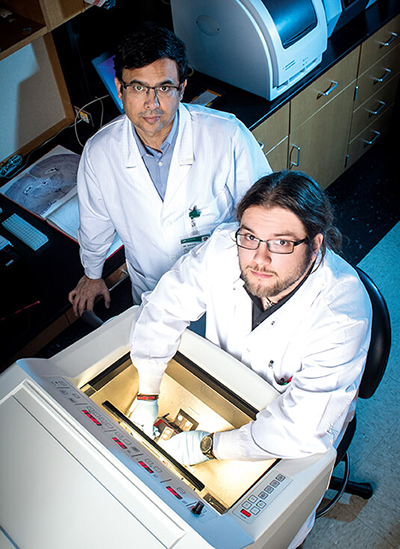 Professor Dwivedi and student Timberlake in lab.