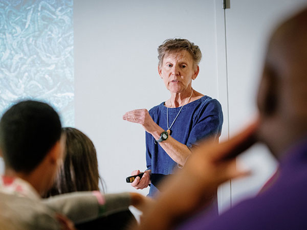 Maggie Amsler teaching in a classroom. 