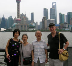 Mohl and wife Sai Sai Dong, of the UAB Department of Nephrology (left), pose with Chinese friends on the Huangpu River, with the new Shanghai in the background. 