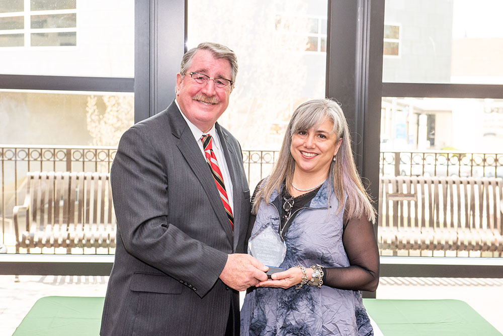 Dean Palazzo congratulating Isabel Rubio.