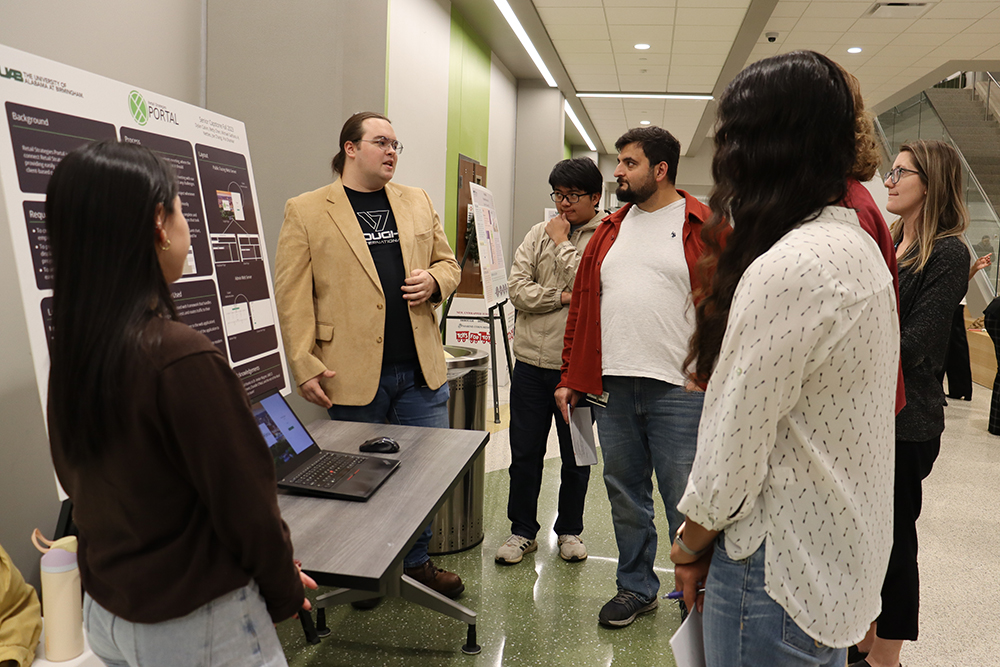 Group of graduate students showing their research.