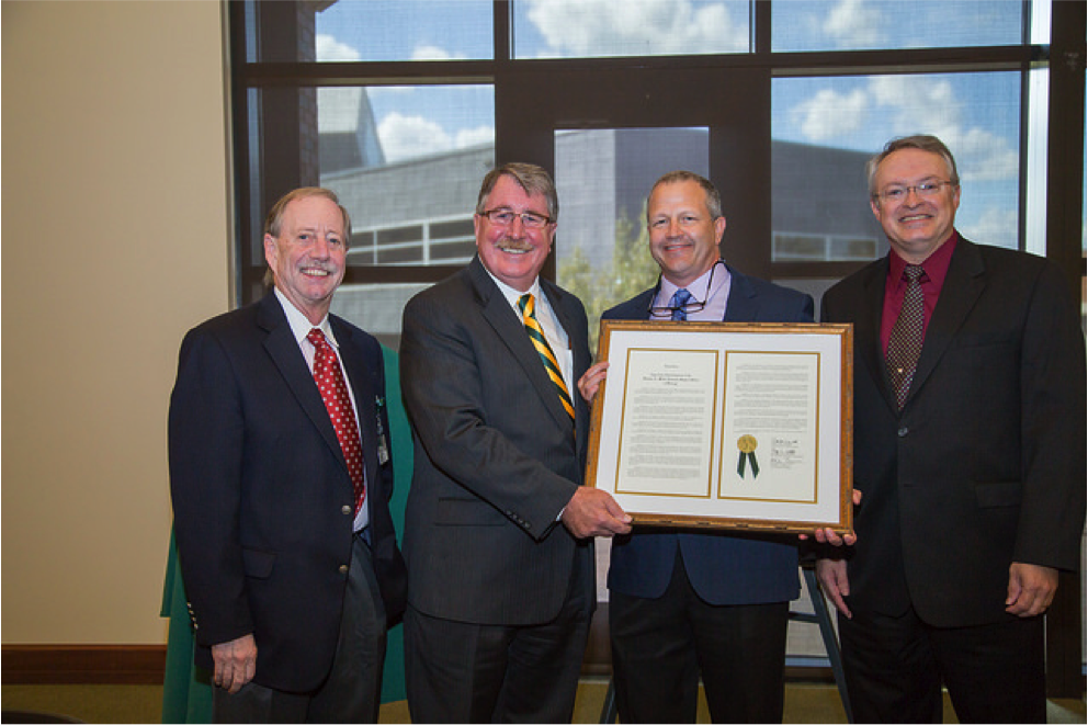 Dr. Steve Austad, chair of the Department of Biology, Dean Palazzo, Dr. Dan Bishop and Dr. Steve Watts