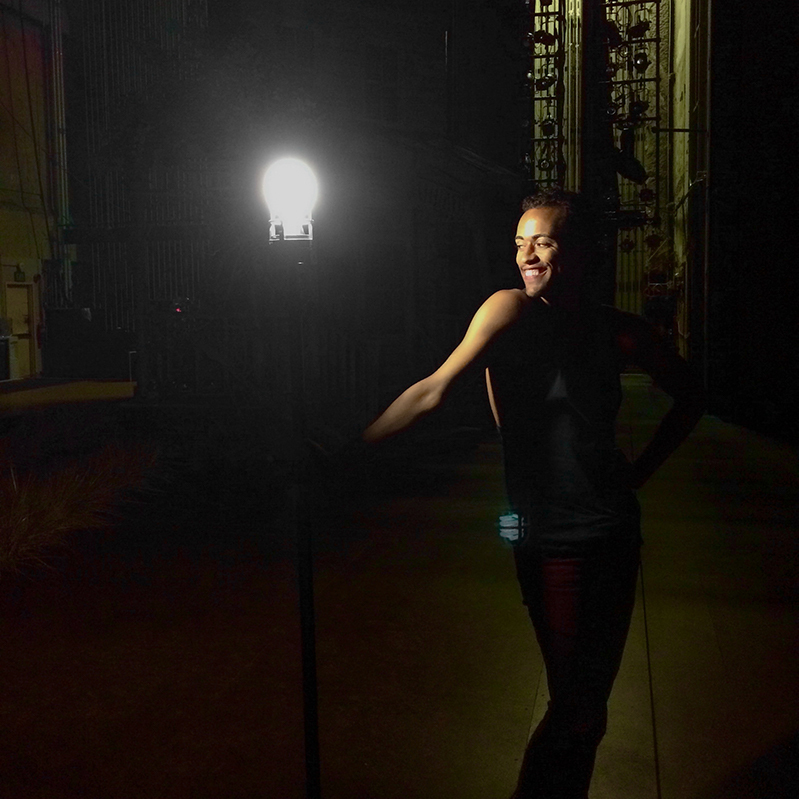 Photo of Jereme backstage with the set's ghost light
