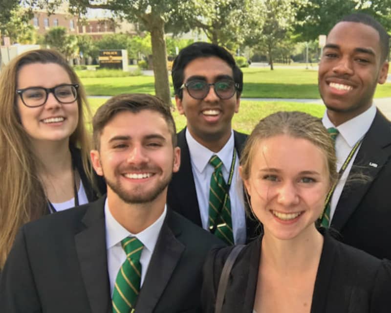Five members of the Ethics Bowl Team posing for a group picture.