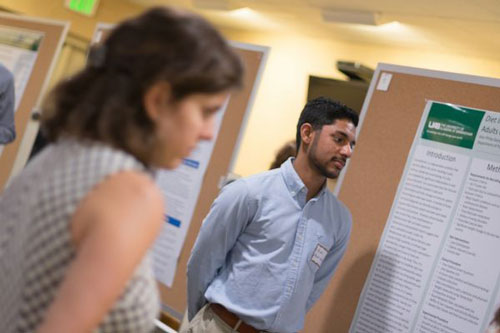 Students presenting research at a conference, 