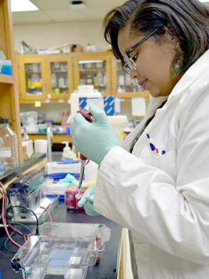 CPCTP alum Kendra Royston, PhD, works in the lab.