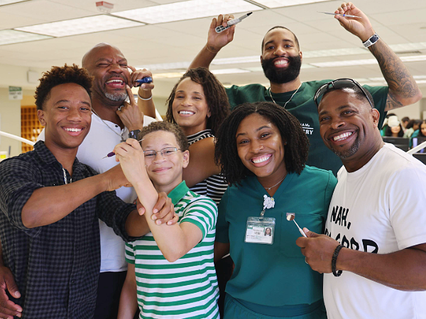 Ashlyn Boyd and her family in the PCD Lab during Family Day
