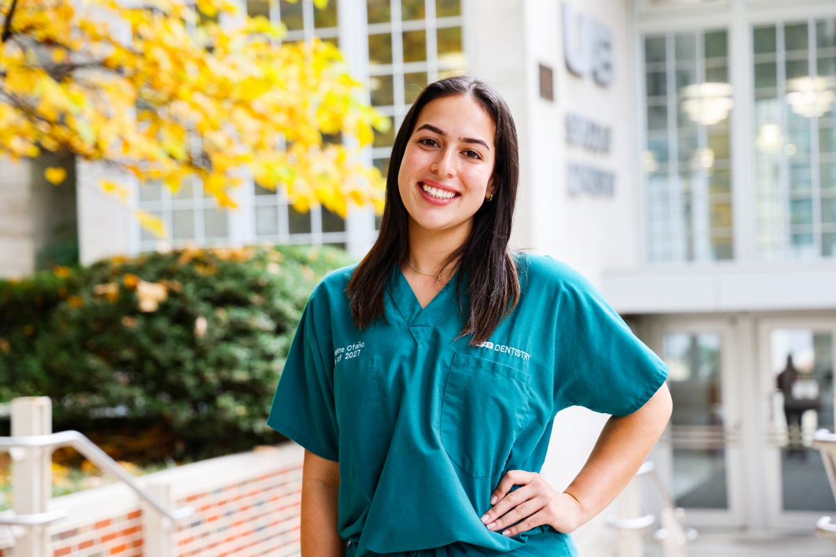 Cathereine Otano standing in front of UAB School of Dentistry