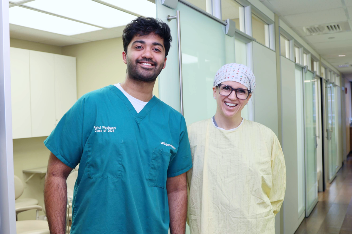 Rahul Wadhwani and Dr. Geisinger standing together in the Perio clinic at UAB School of Dentistry